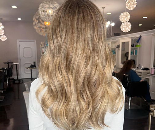 Close-up of dimensional blonde highlights blended through shoulder-length hair